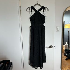 Beautiful black dress with cutouts and a detailed embroidered chiffon overlay.